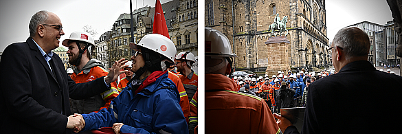 Bürgermeister Andreas Bovenschulte begrüßt die Beschäftigten der Bremer Hütte vor dem Rathaus.