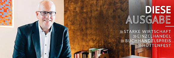 Bürgermeister Andreas Bovenschulte sitzt am Schreibtisch. 